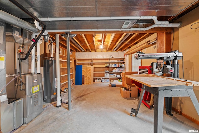 3513 33rd Street Ct, Moline, IL 61265 - unfinished basement featuring water heater and a workshop area