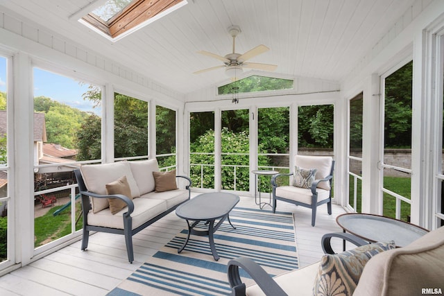 3513 33rd Street Ct, Moline, IL 61265 - sunroom featuring ceiling fan, vaulted ceiling, a skylight, an outdoor living space, and healthy amount of natural light