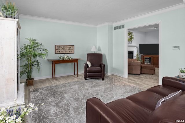 3513 33rd Street Ct, Moline, IL 61265 - living room with wood finished floors, crown molding, a fireplace, and baseboards