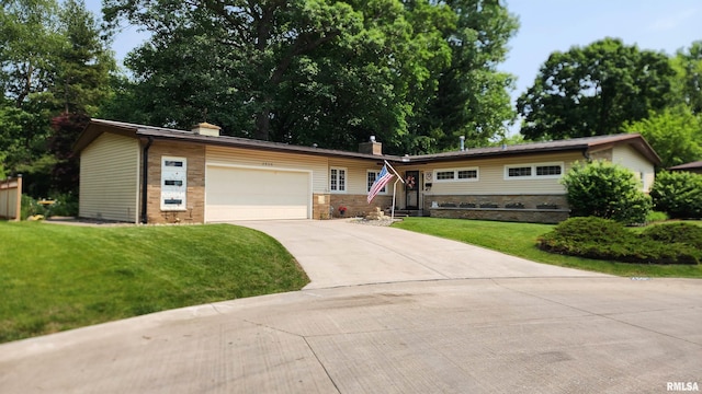 2606 4th Street Ct, East Moline, IL 61244 - ranch-style house featuring a chimney, concrete driveway, a front lawn, an attached garage, and stone siding