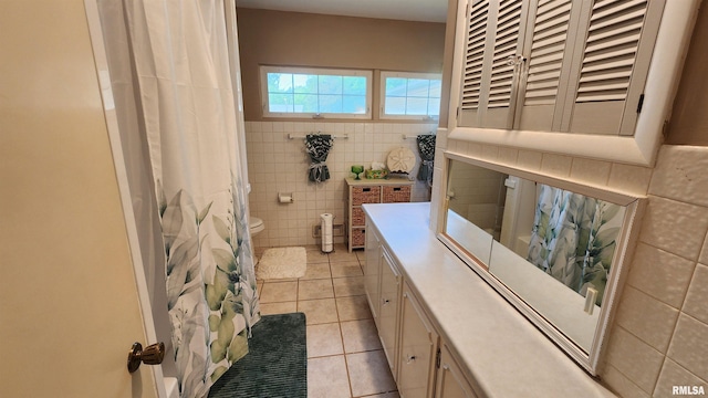 2606 4th Street Ct, East Moline, IL 61244 - bathroom with tile patterned flooring, tile walls, toilet, and vanity