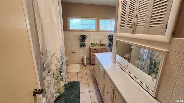 2606 4th Street Ct, East Moline, IL 61244 - bathroom with toilet, tile walls, tile patterned floors, and vanity
