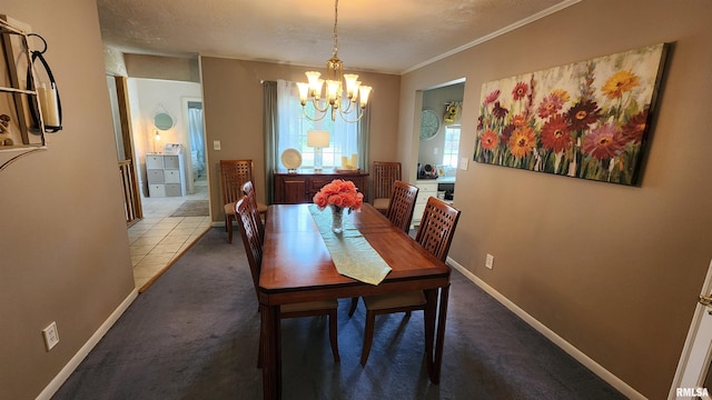 2606 4th Street Ct, East Moline, IL 61244 - dining room with a chandelier, carpet flooring, crown molding, and baseboards