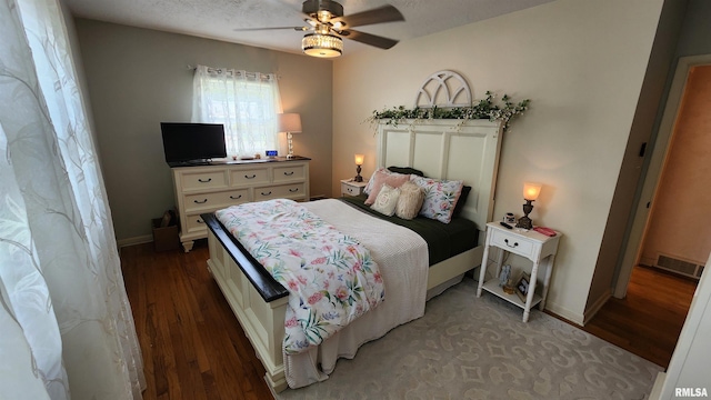 2606 4th Street Ct, East Moline, IL 61244 - bedroom with wood finished floors, a ceiling fan, and baseboards