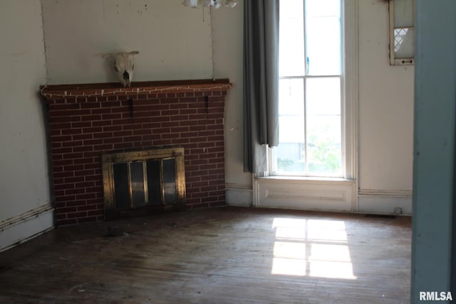 205 W Court St, Cambridge, IL 61238 - unfurnished living room with a fireplace and wood finished floors
