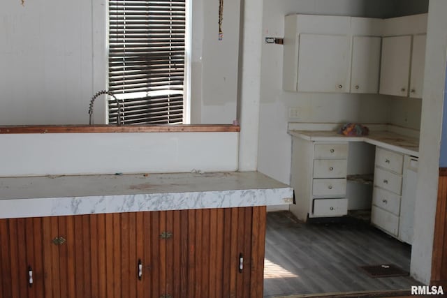 205 W Court St, Cambridge, IL 61238 - kitchen with dark wood-style flooring, light countertops, and white cabinets