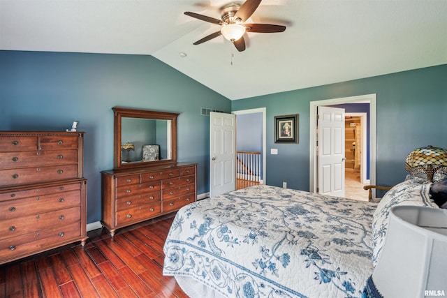 7318 35th Avenue Ct, Moline, IL 61265 - bedroom with wood finished floors, vaulted ceiling, baseboards, a ceiling fan, and ensuite bath