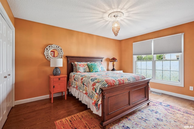 7318 35th Avenue Ct, Moline, IL 61265 - bedroom with baseboards, wood finished floors, and a closet
