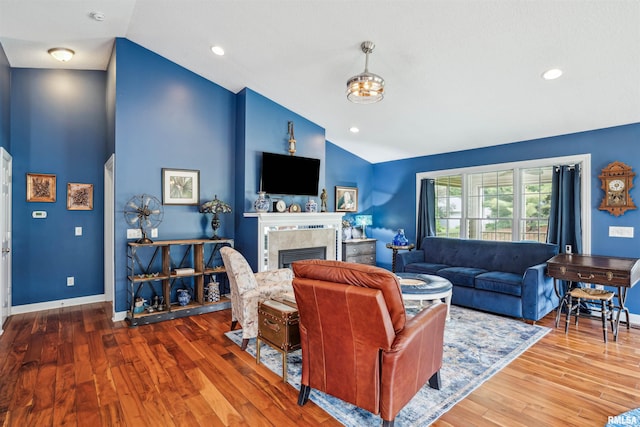 7318 35th Avenue Ct, Moline, IL 61265 - living room featuring a fireplace, wood finished floors, high vaulted ceiling, baseboards, and recessed lighting
