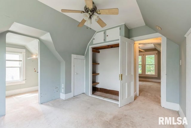 2308 18th Ave, Moline, IL 61265 - unfurnished bedroom featuring light colored carpet, vaulted ceiling, baseboards, and a closet