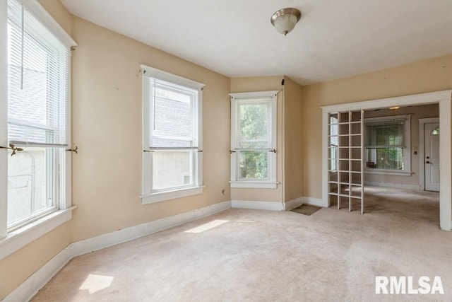 2308 18th Ave, Moline, IL 61265 - unfurnished room featuring carpet flooring and baseboards