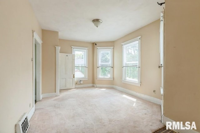 2308 18th Ave, Moline, IL 61265 - carpeted spare room featuring baseboards