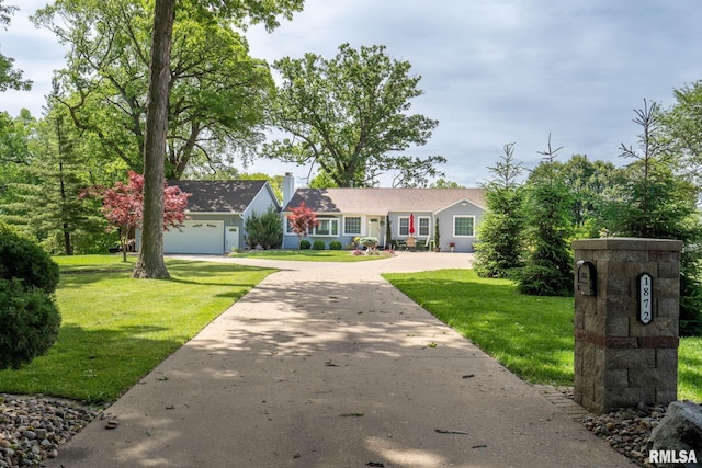 1872 19th Ave, Moline, IL 61265 - single story home featuring concrete driveway, a front lawn, and a garage