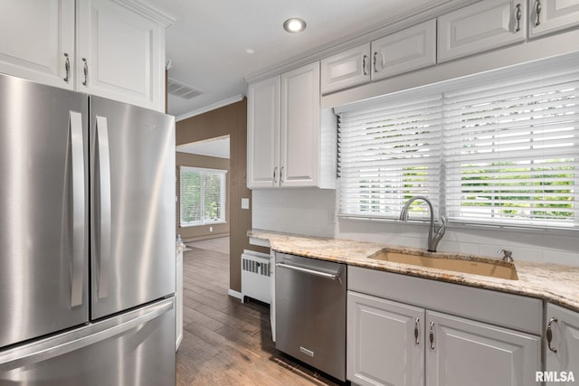 1872 19th Ave, Moline, IL 61265 - kitchen with stainless steel appliances, light wood-style flooring, white cabinetry, light stone countertops, and recessed lighting