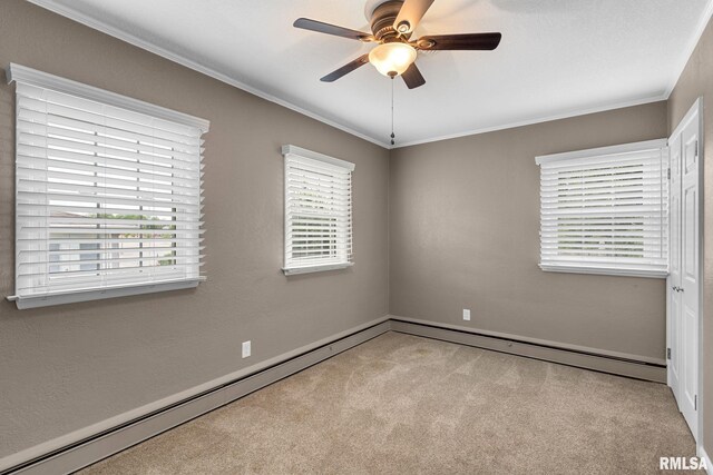 1872 19th Ave, Moline, IL 61265 - carpeted spare room with a ceiling fan, ornamental molding, a baseboard heating unit, and a baseboard radiator