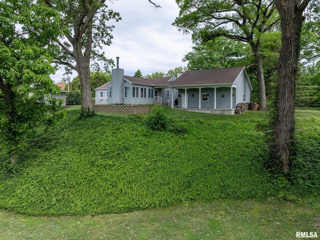 1872 19th Ave, Moline, IL 61265 - ranch-style home with a chimney and a porch