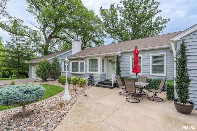 1872 19th Ave, Moline, IL 61265 - view of patio with a garage