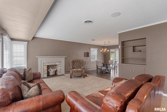 1872 19th Ave, Moline, IL 61265 - living area featuring a chandelier, ornamental molding, carpet floors, and a fireplace with flush hearth