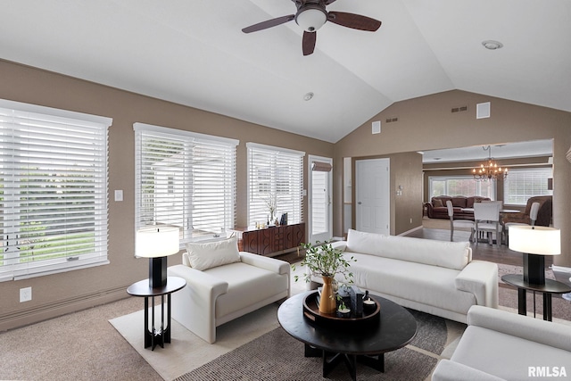 1872 19th Ave, Moline, IL 61265 - living area with a chandelier, lofted ceiling, a ceiling fan, and plenty of natural light