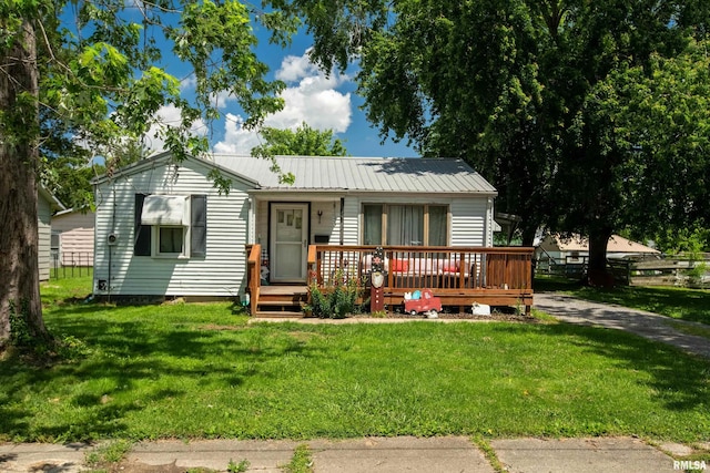 1013 Kirkpatrick St, Benton, IL 62812 - view of front of property featuring a front lawn, metal roof, and a wooden deck