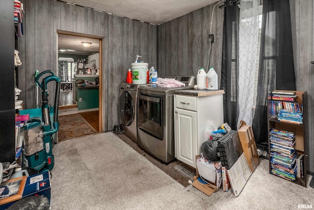 1013 Kirkpatrick St, Benton, IL 62812 - washroom featuring washing machine and dryer, light carpet, wood walls, and cabinet space