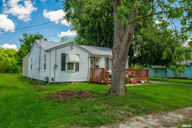 1013 Kirkpatrick St, Benton, IL 62812 - ranch-style home with a front lawn, a deck, and metal roof