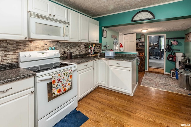 1013 Kirkpatrick St, Benton, IL 62812 - kitchen with white appliances, a textured ceiling, light wood-style floors, and white cabinetry