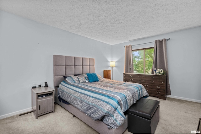 5721 Taylor St, Davenport, IA 52806 - carpeted bedroom with a textured ceiling and baseboards