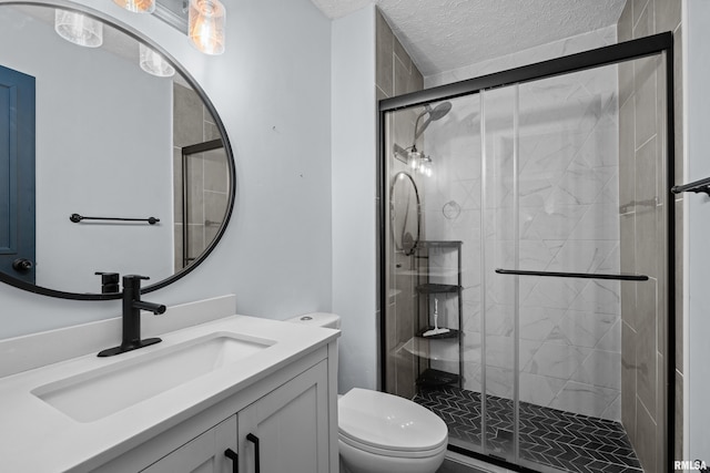 5721 Taylor St, Davenport, IA 52806 - bathroom featuring toilet, vanity, a stall shower, and a textured ceiling