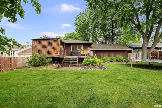 5721 Taylor St, Davenport, IA 52806 - rear view of house with a wooden deck and a trampoline