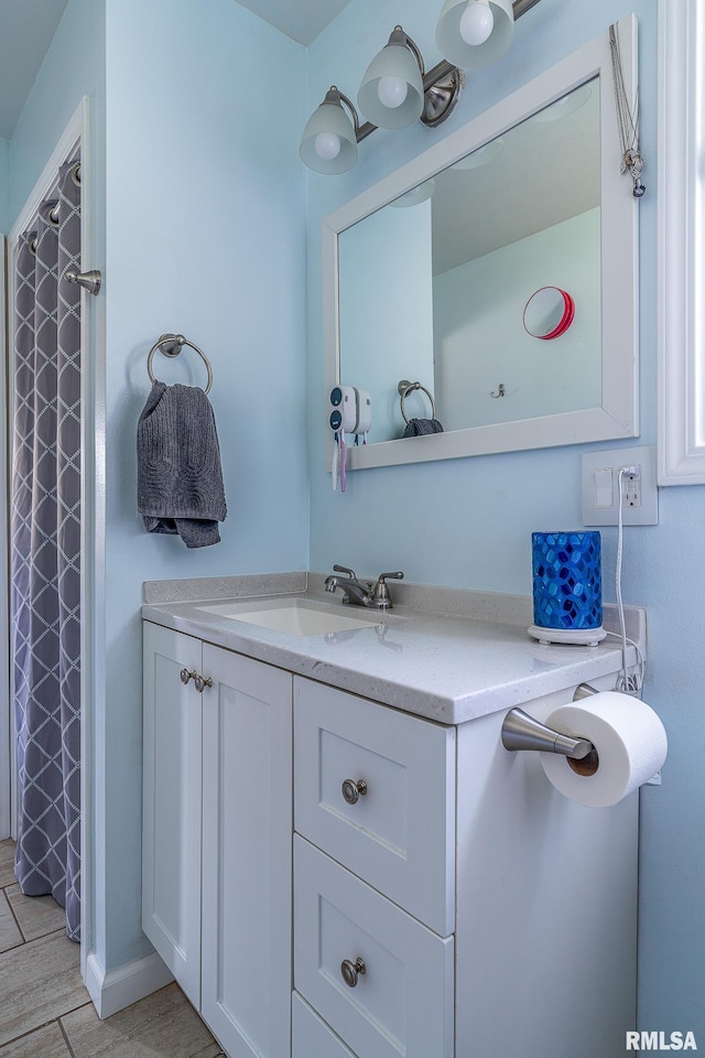 2612 7th St, Moline, IL 61265 - bathroom with vanity, curtained shower, and wood finished floors