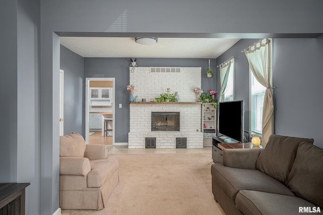 2612 7th St, Moline, IL 61265 - carpeted living room featuring a brick fireplace and baseboards