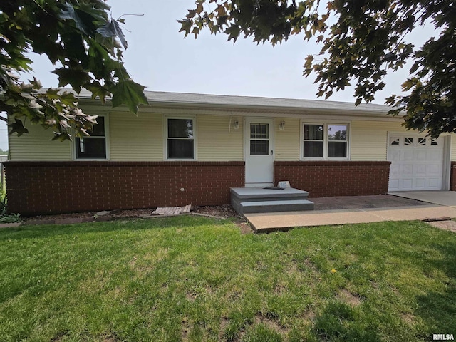 1907 S 15th Ave, Clinton, IA 52732 - ranch-style home with brick siding, a garage, a front lawn, and concrete driveway