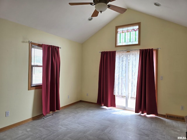 1907 S 15th Ave, Clinton, IA 52732 - spare room with ceiling fan, lofted ceiling, and baseboards