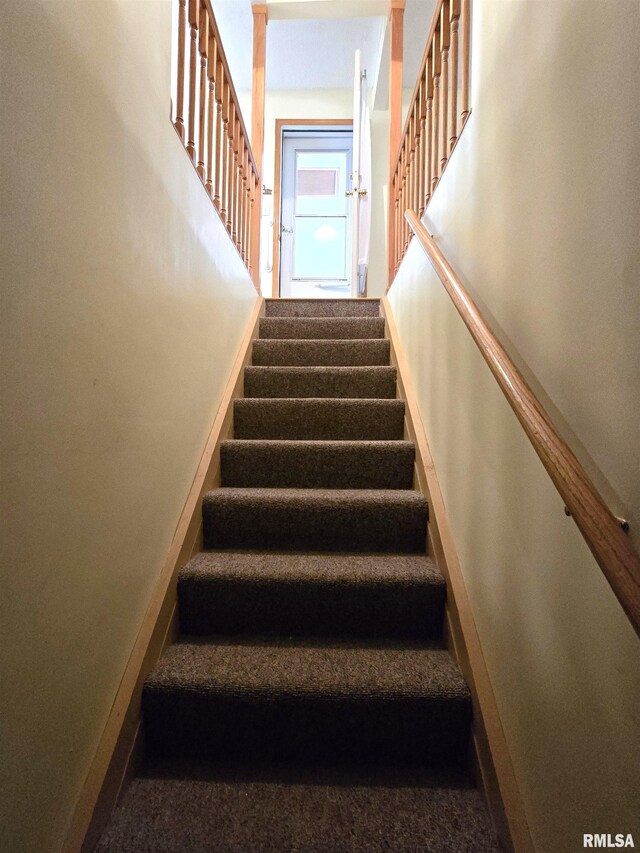 1907 S 15th Ave, Clinton, IA 52732 - staircase featuring baseboards and carpet
