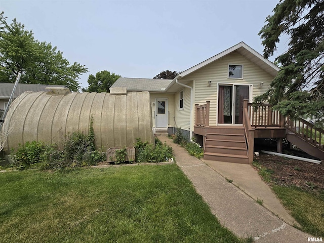 1907 S 15th Ave, Clinton, IA 52732 - view of front of home with a deck, a front lawn, and stairs