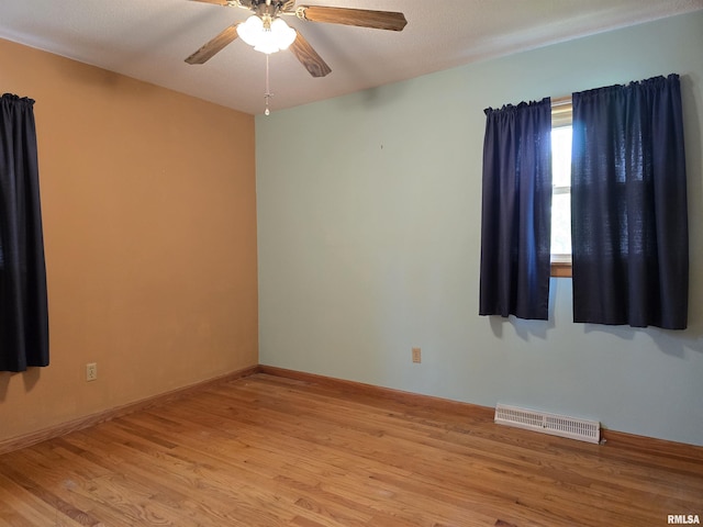1907 S 15th Ave, Clinton, IA 52732 - empty room featuring light wood-style floors and ceiling fan