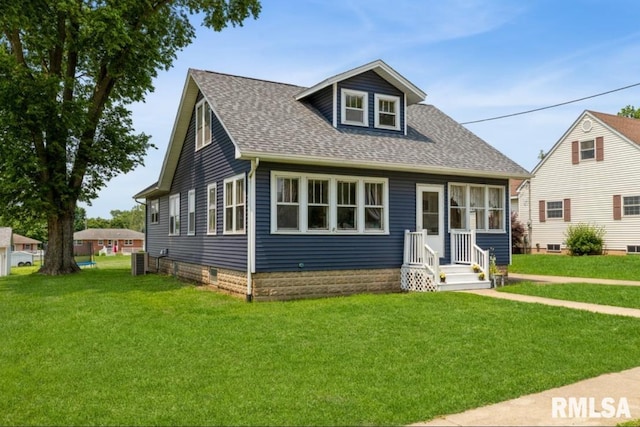 308 N Main St, Wheatland, IA 52777 - bungalow featuring a front lawn and roof with shingles