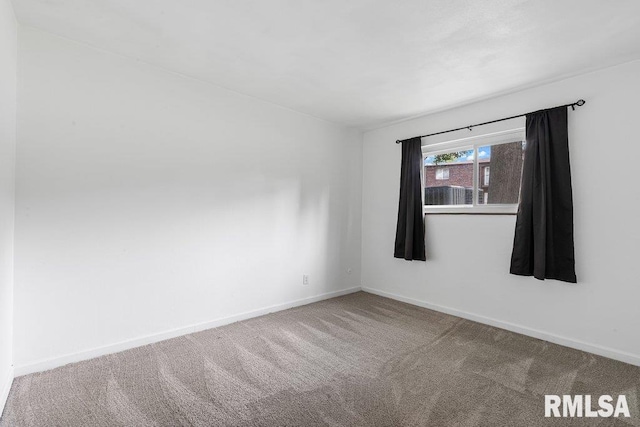 3069 4th St Unit 4, Moline, IL 61265 - unfurnished room featuring baseboards and carpet