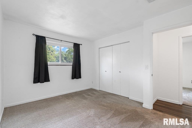 3069 4th St Unit 4, Moline, IL 61265 - unfurnished bedroom featuring carpet floors and a closet