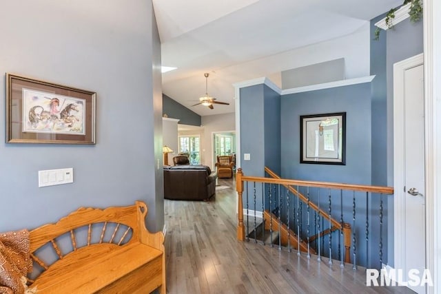 461 45th Ave, East Moline, IL 61244 - hall featuring an upstairs landing, vaulted ceiling, and wood finished floors
