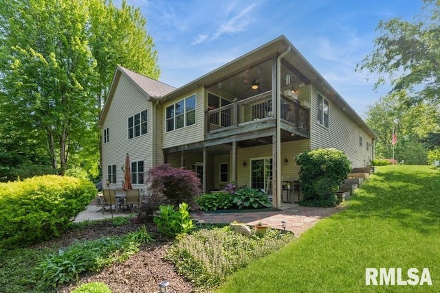 461 45th Ave, East Moline, IL 61244 - back of property with a patio and a lawn