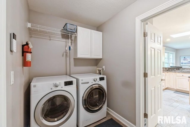 461 45th Ave, East Moline, IL 61244 - laundry room featuring washing machine and clothes dryer, cabinet space, and baseboards