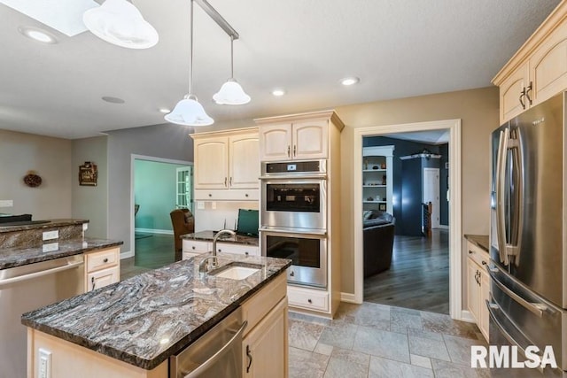 461 45th Ave, East Moline, IL 61244 - kitchen with stainless steel appliances, light brown cabinets, a sink, a center island with sink, and recessed lighting