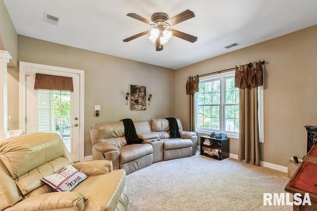 461 45th Ave, East Moline, IL 61244 - living room with a ceiling fan, baseboards, and light carpet