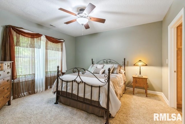 461 45th Ave, East Moline, IL 61244 - carpeted bedroom featuring ceiling fan and baseboards