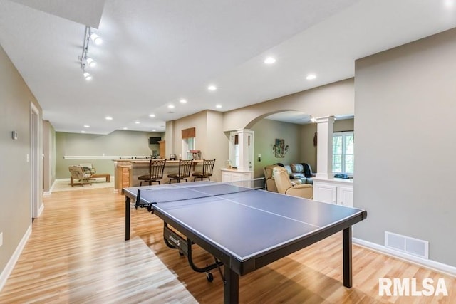 461 45th Ave, East Moline, IL 61244 - game room with decorative columns, arched walkways, light wood-style flooring, baseboards, and recessed lighting