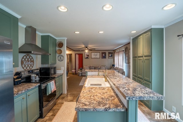 11271 W Center Rd, Mulkeytown, IL 62865 - kitchen featuring green cabinetry, stainless steel appliances, wall chimney range hood, a sink, and recessed lighting