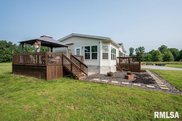 11271 W Center Rd, Mulkeytown, IL 62865 - back of property featuring a gazebo, a lawn, a wooden deck, and stairway