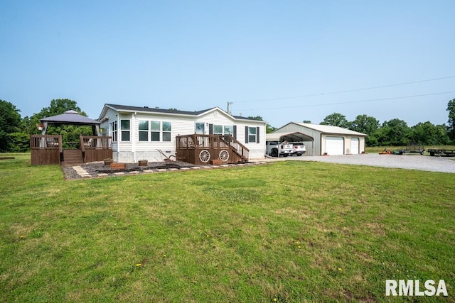 11271 W Center Rd, Mulkeytown, IL 62865 - manufactured / mobile home with a front yard, a gazebo, a carport, and gravel driveway